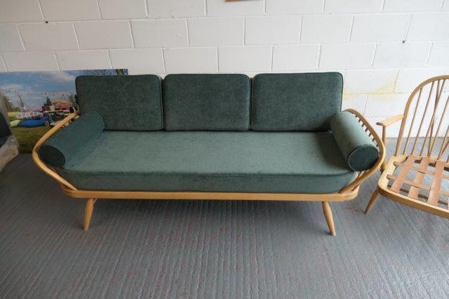 Ercol 355 Studio Couch in Ross Fabrics Pimlico Ocean with bolsters, and piping