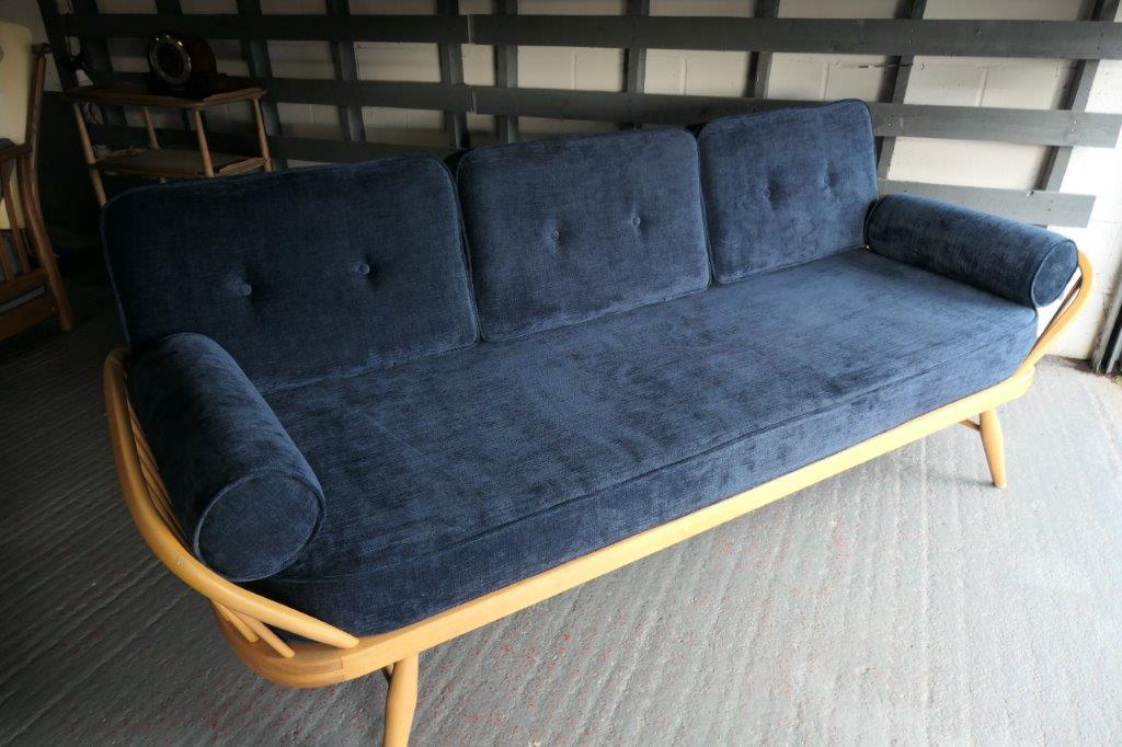 Ercol 355 Studio Couch in Ross Fabrics Pimlico Navy with bolsters, buttons and piping