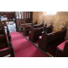 Old pews with new red cushions