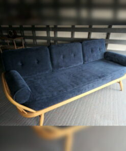 Ercol 355 Studio Couch in Ross Fabrics Pimlico Navy with bolsters, buttons and piping