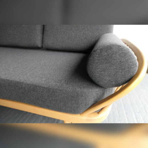 The Ercol Daybed looking good in our Herringbone Grey, with bolsters!