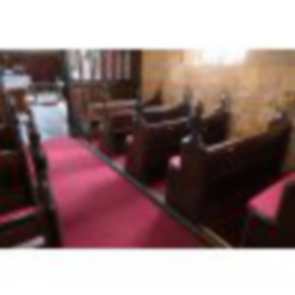 Old pews with new red cushions