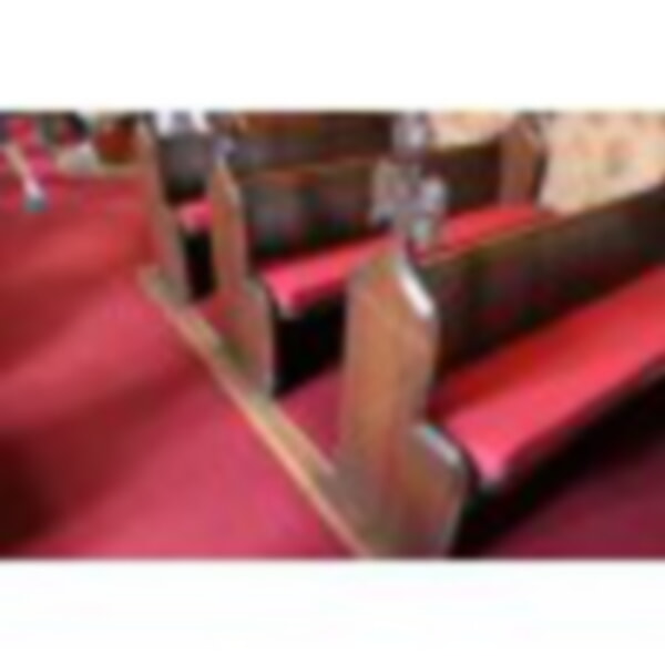 Old pews with new red cushions