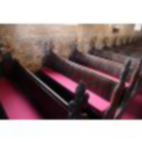 Old pews with new red cushions