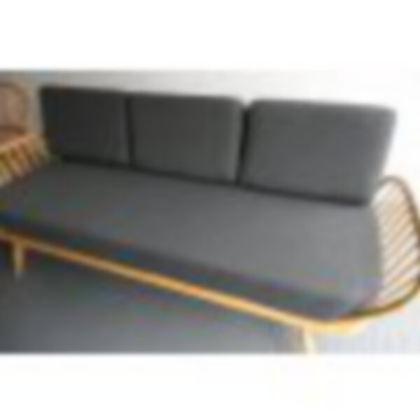 The Ercol Daybed looking good in our Herringbone Grey, with bolsters!